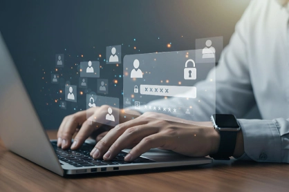 Person typing on a laptop with floating security icons (profiles, locks, and password fields) representing online data protection and cybersecurity.",